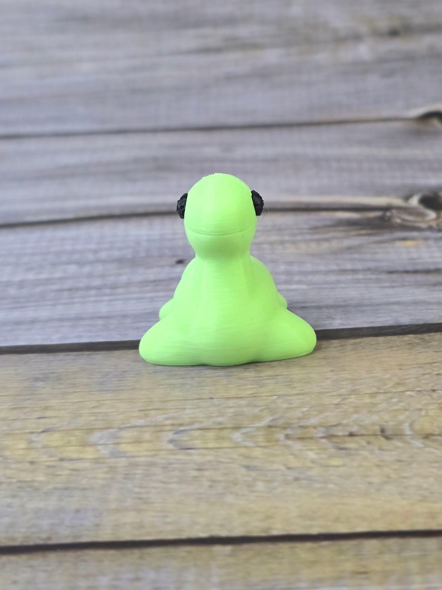 3D Printed Nessy Keychain ā Cute Articulated Sea Monster Toy