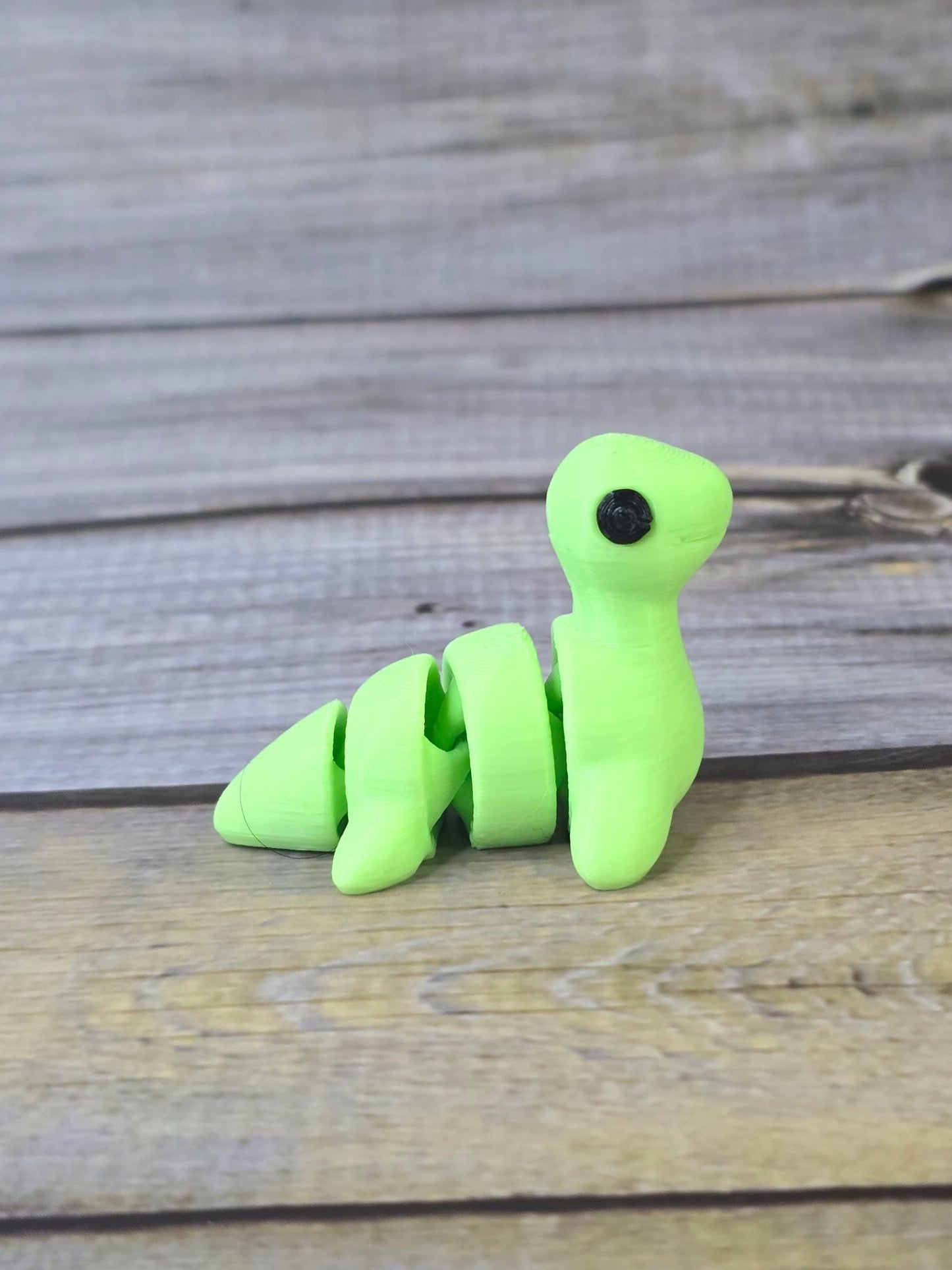 3D Printed Nessy Keychain ā Cute Articulated Sea Monster Toy