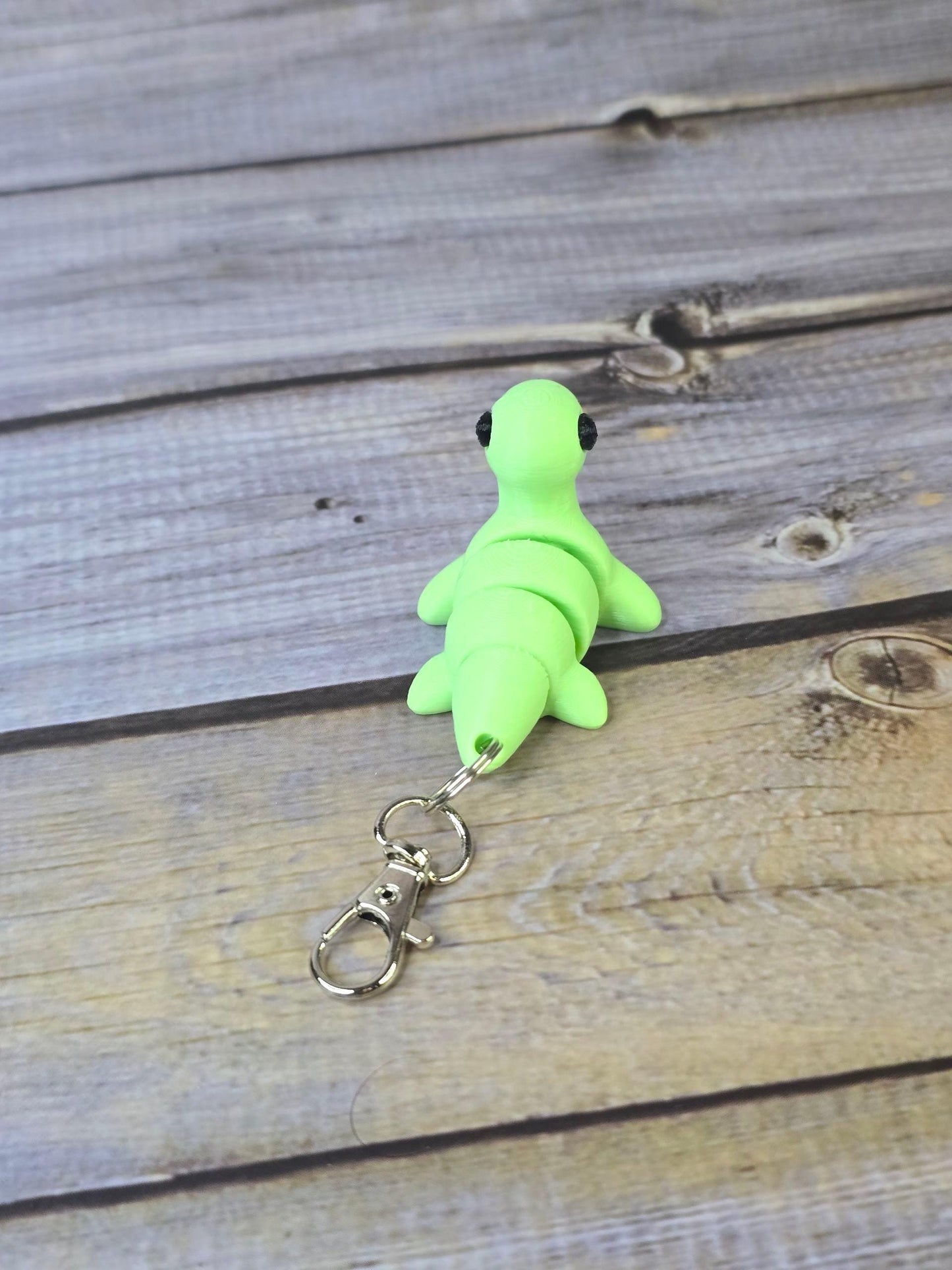 3D Printed Nessy Keychain ā Cute Articulated Sea Monster Toy