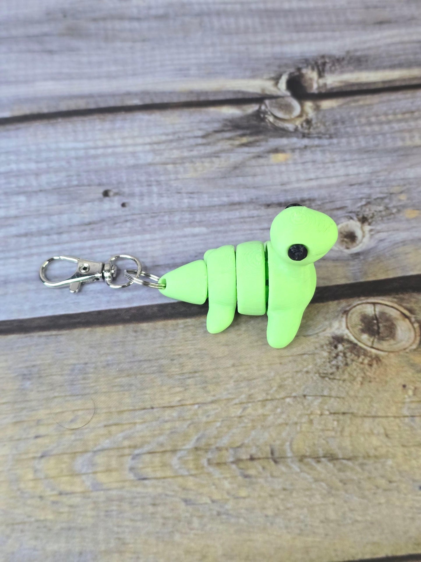 3D Printed Nessy Keychain ā Cute Articulated Sea Monster Toy