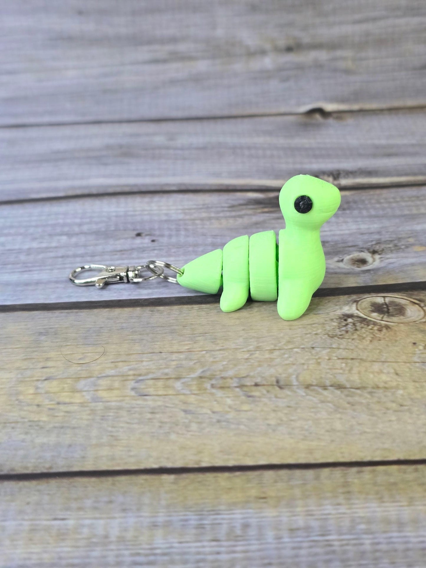 3D Printed Nessy Keychain ā Cute Articulated Sea Monster Toy