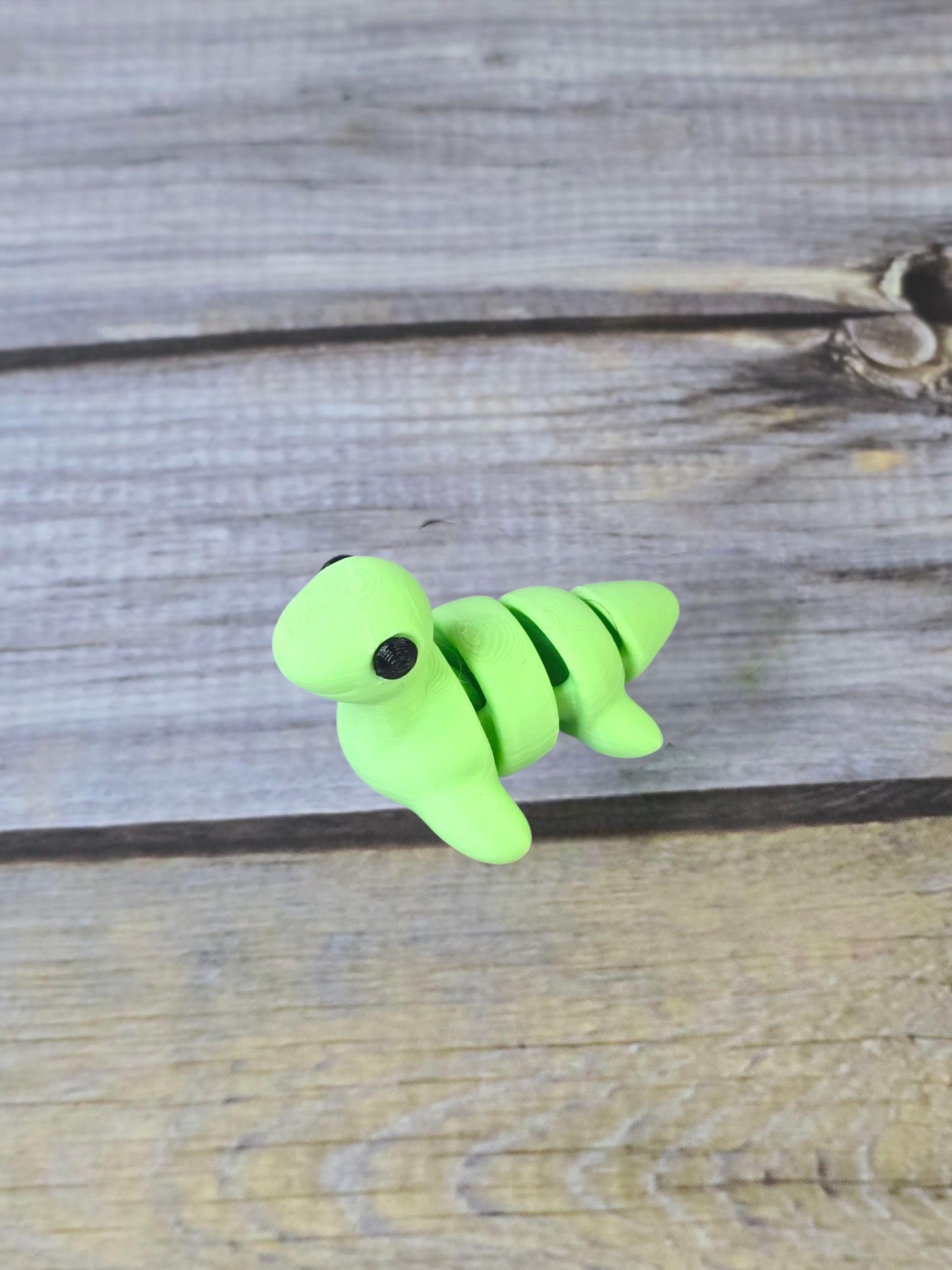3D Printed Nessy Keychain ā Cute Articulated Sea Monster Toy